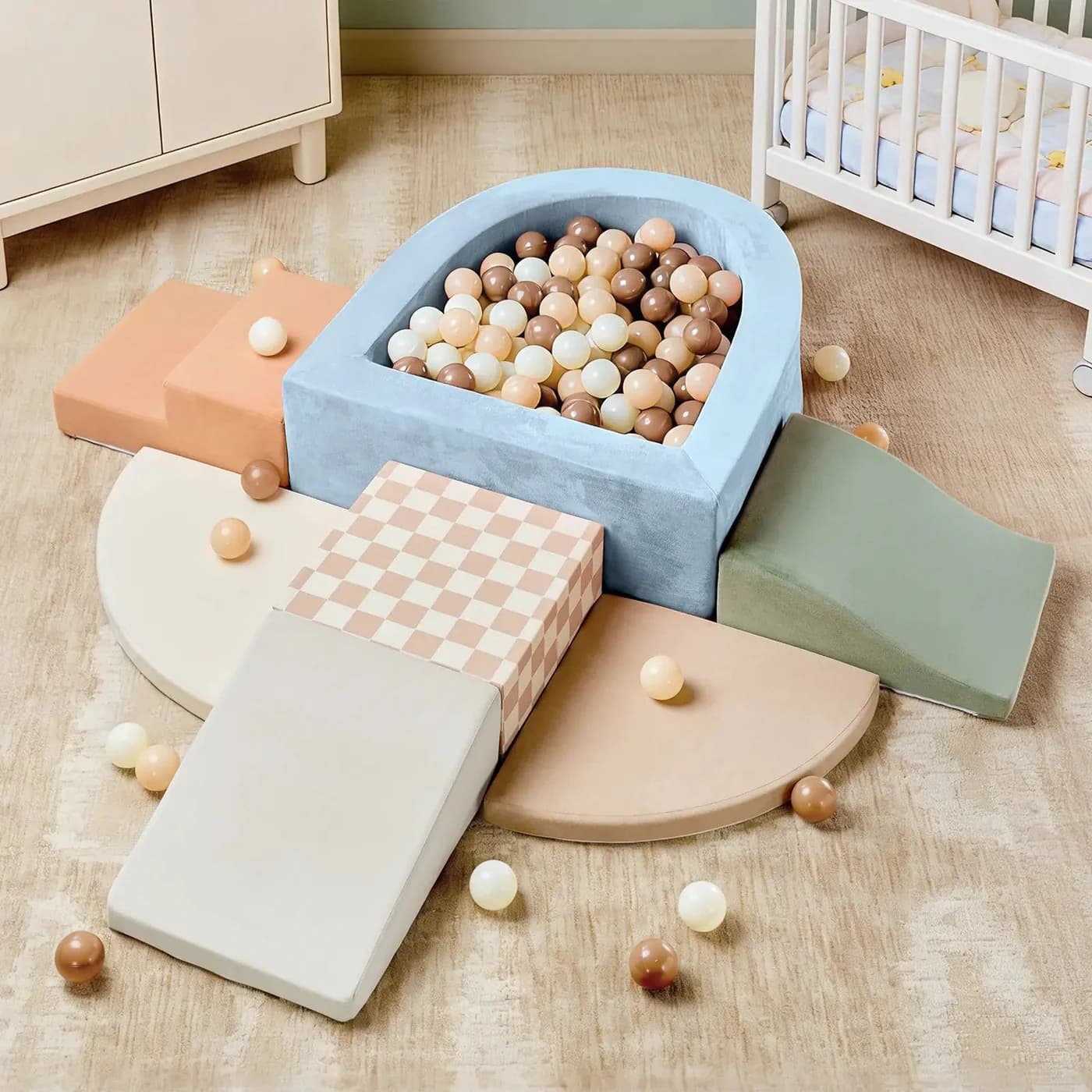 Tiny Land PlayNest soft foam climbing blocks and a curved ball pit with wooden-colored balls