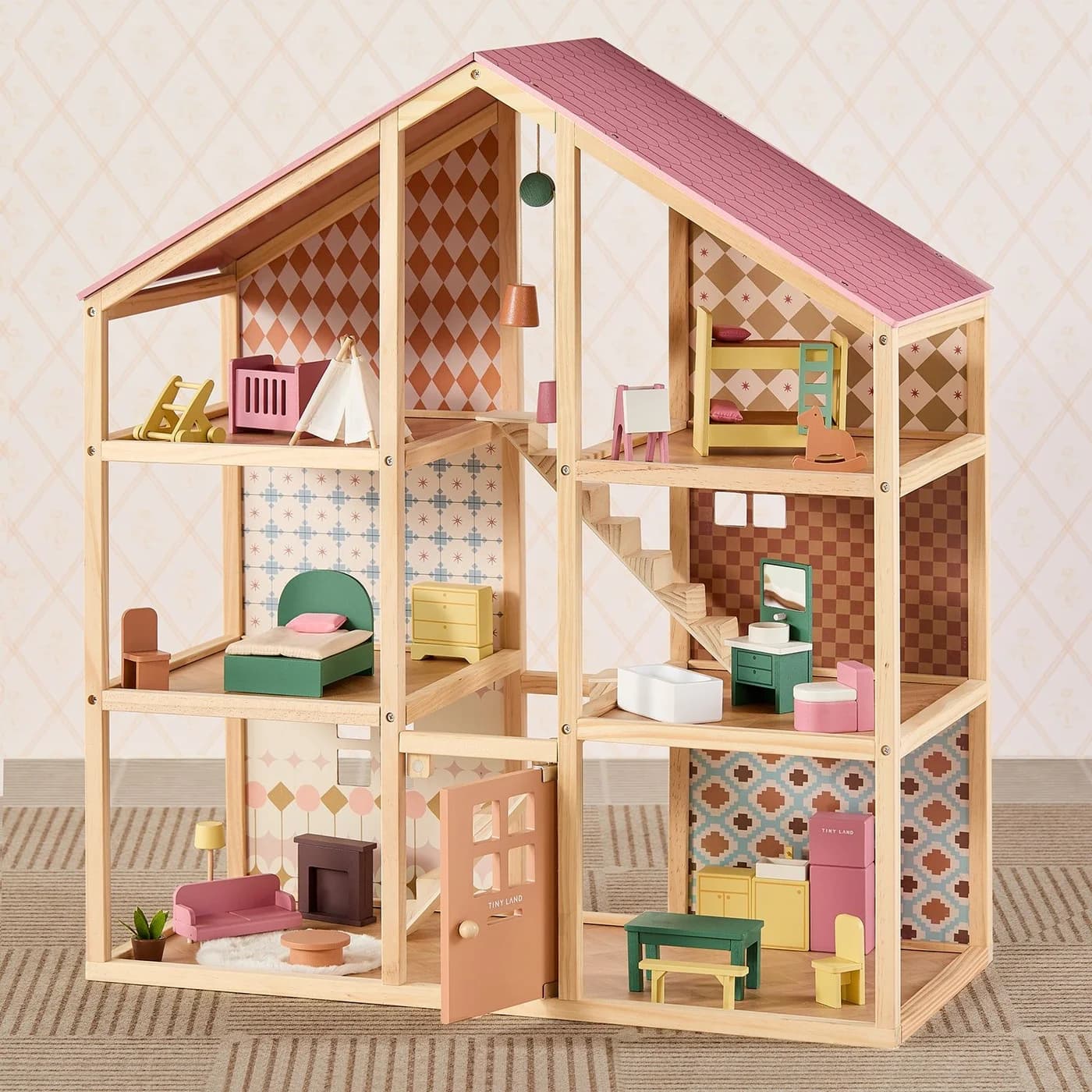 Tiny Land Sweetwood wooden dollhouse with three levels, a pink roof and furniture in each room