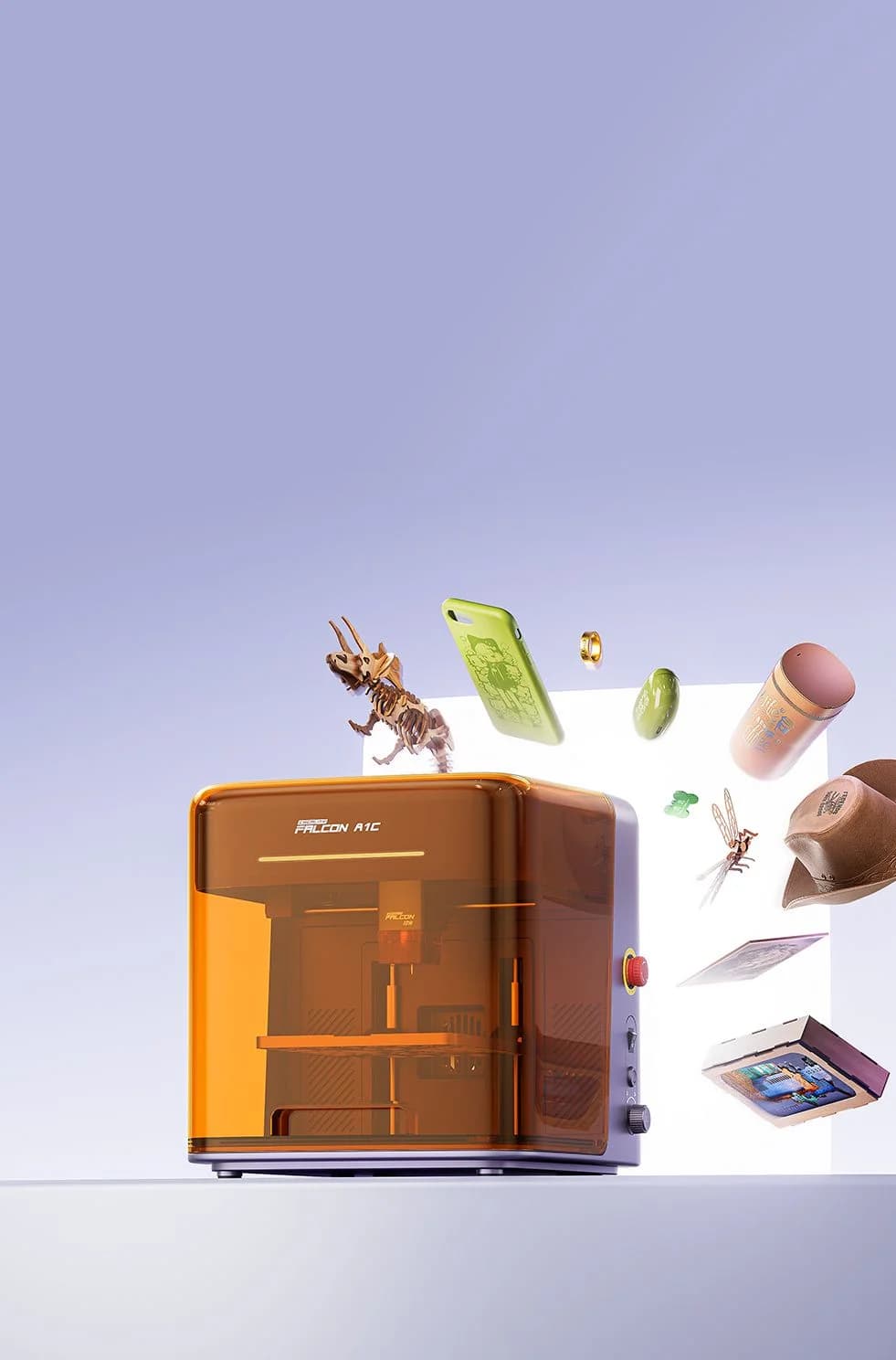 Creality Falcon A1C orange laser engraver surrounded by floating engraved items