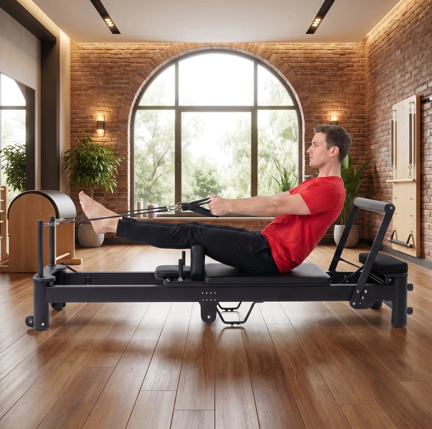 PersonalHour Luraush foldable aluminum Pilates reformer in a brick-walled studio